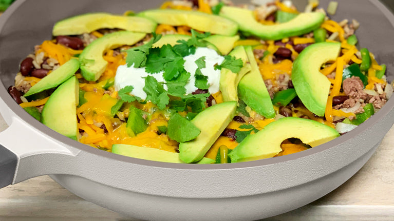 Beef Burrito Bowl Recipe in The Pan in Gray topped with Avocados and cilantro