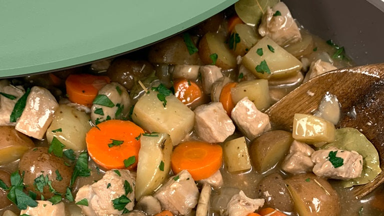 Irish Pork Stew Recipe inside of the Cool Willow Pan being stirred with The Spoon