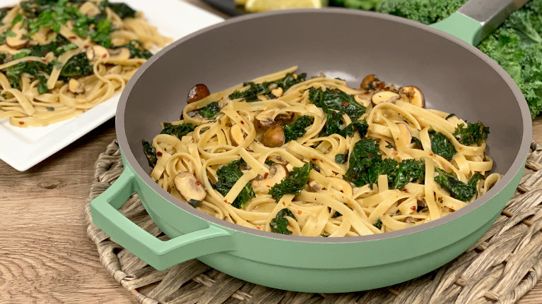 Spicy Garlic Mushroom Fettuccine inside The pan topped off with Cheddar