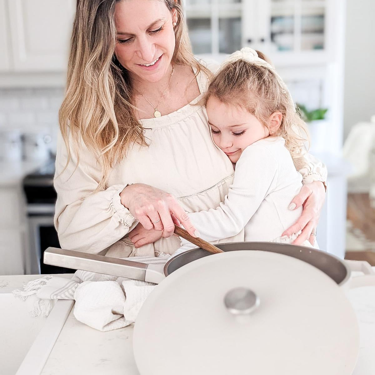 Happy mother and daughter cooking with The Pan by Perco