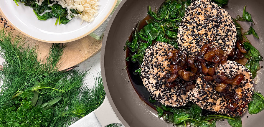 Sesame Coated Pork with Apricot Sauce in The Pan by Perco with Garnish and a plate to the side