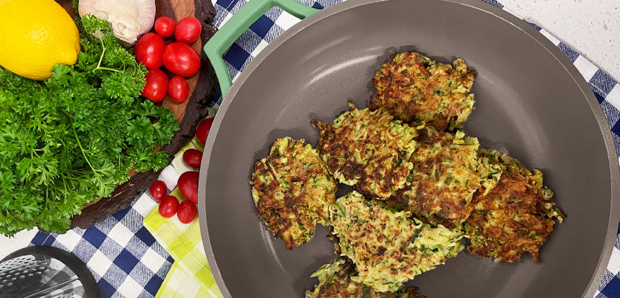 Zucchini Fritters cooked in The Pan by Perco with garnish on the side