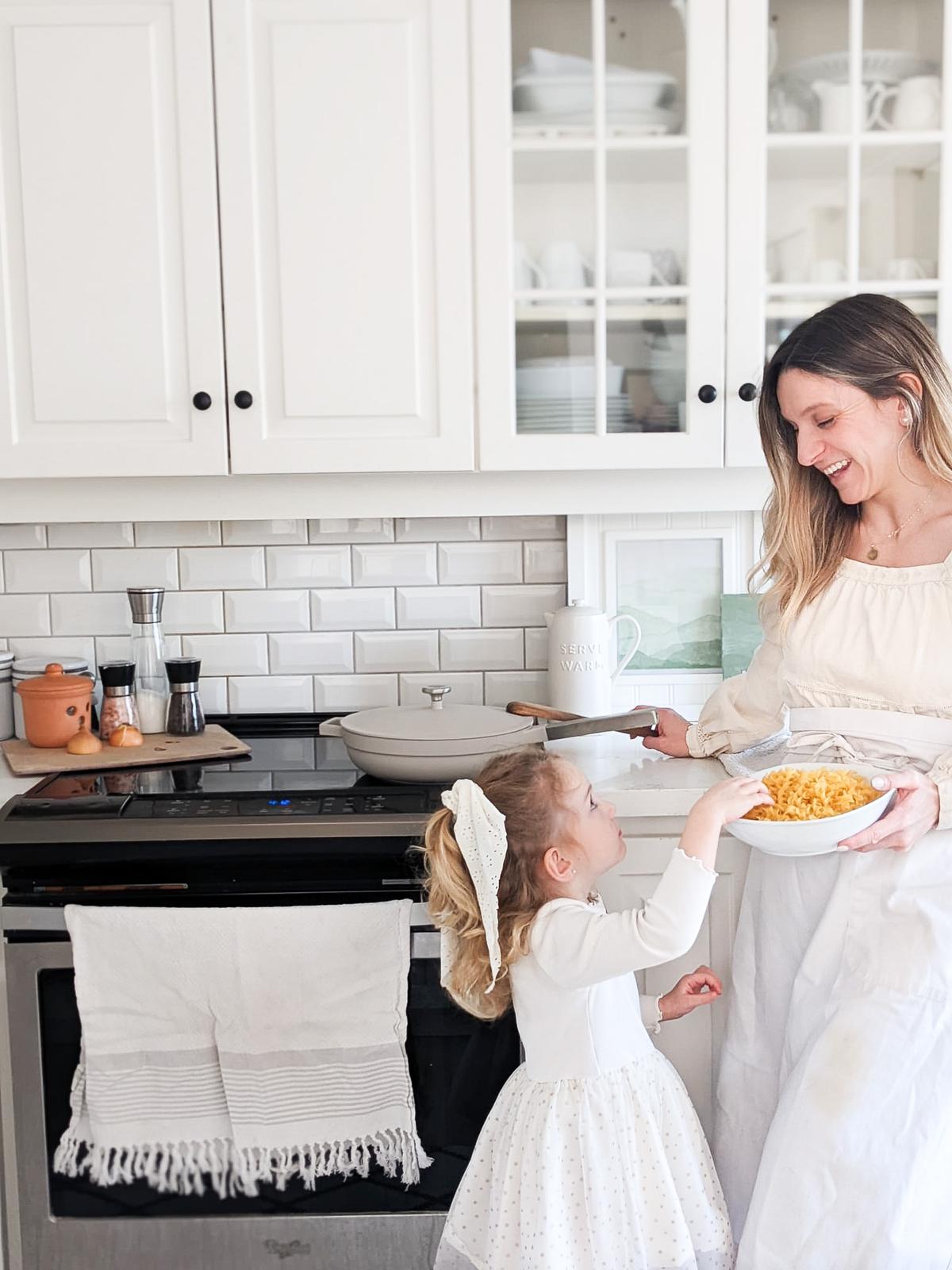 A happy mother and daughter sharing a meal that was cooked with The Pan by Perco