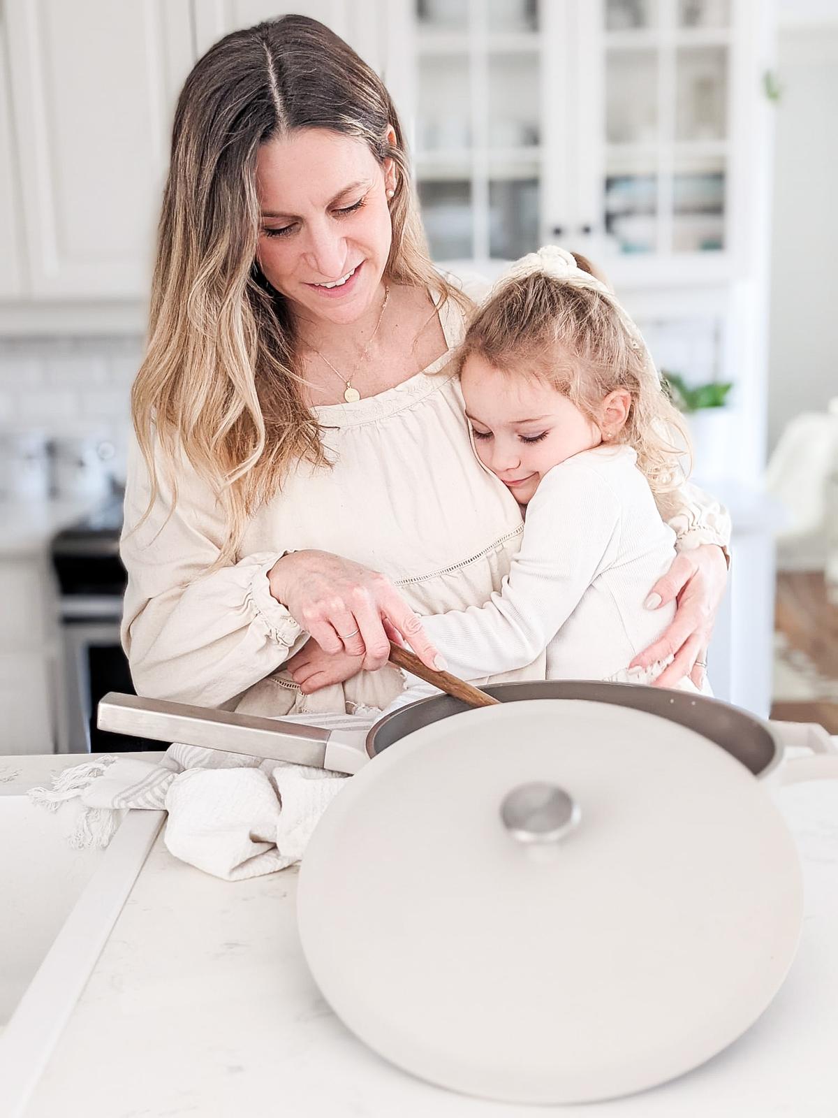 Happy mother and daughter cooking with The Pan by Perco